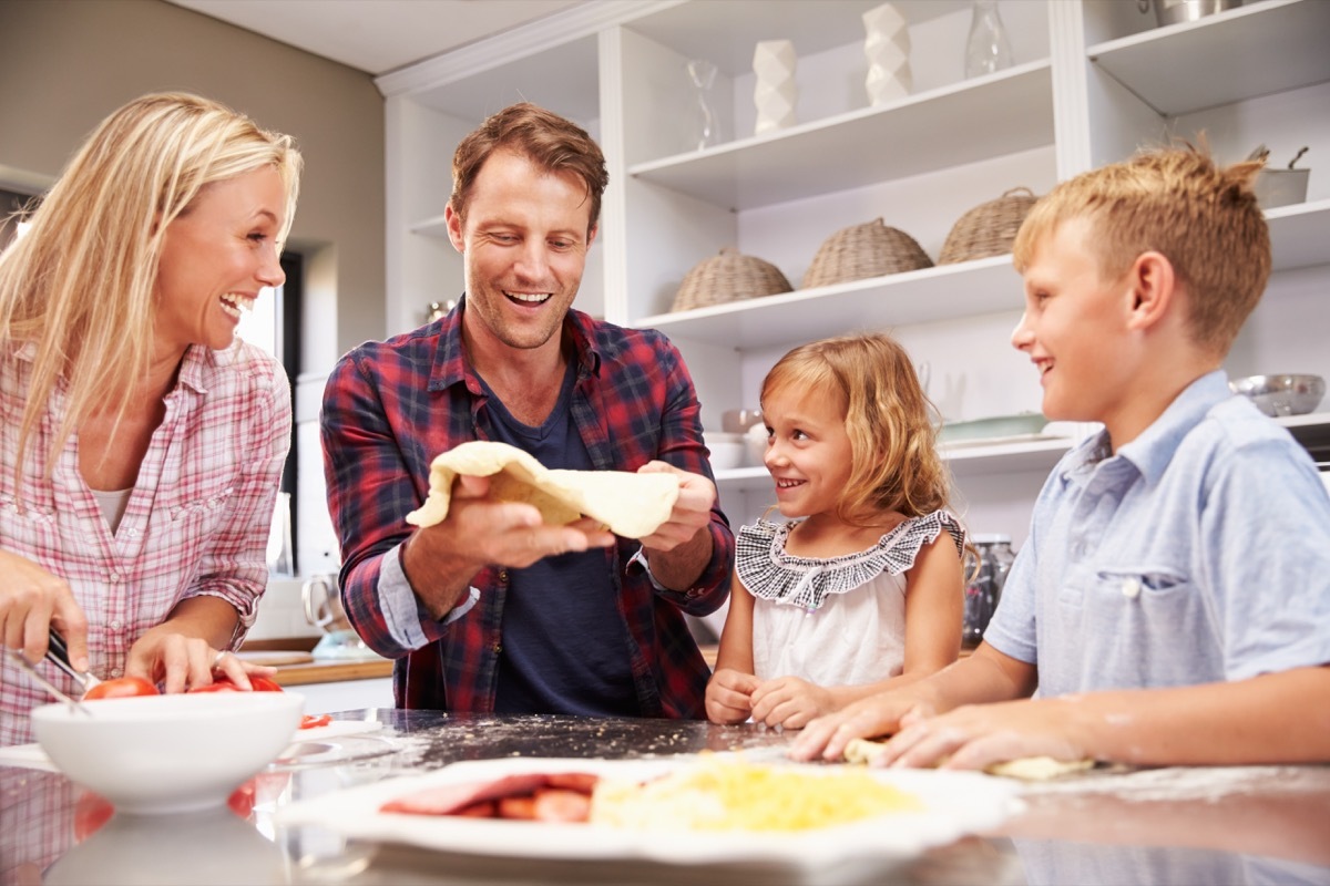 Family making pizza together