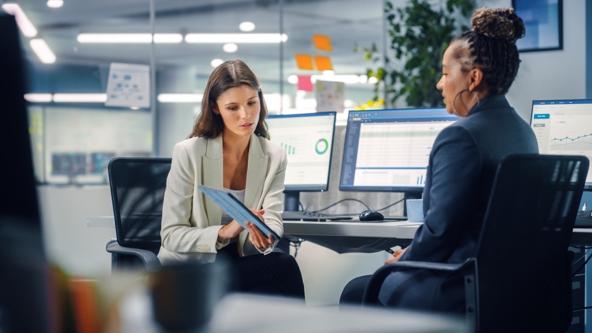 analytical woman with colleague