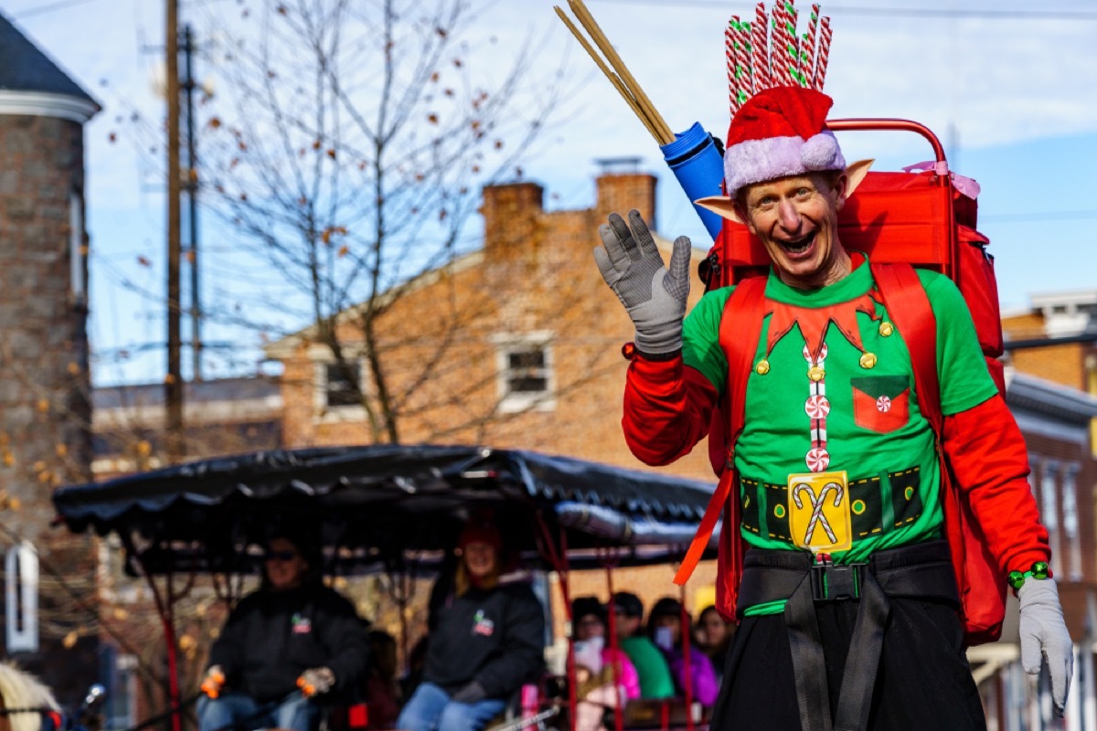 elf waving in christmas parade