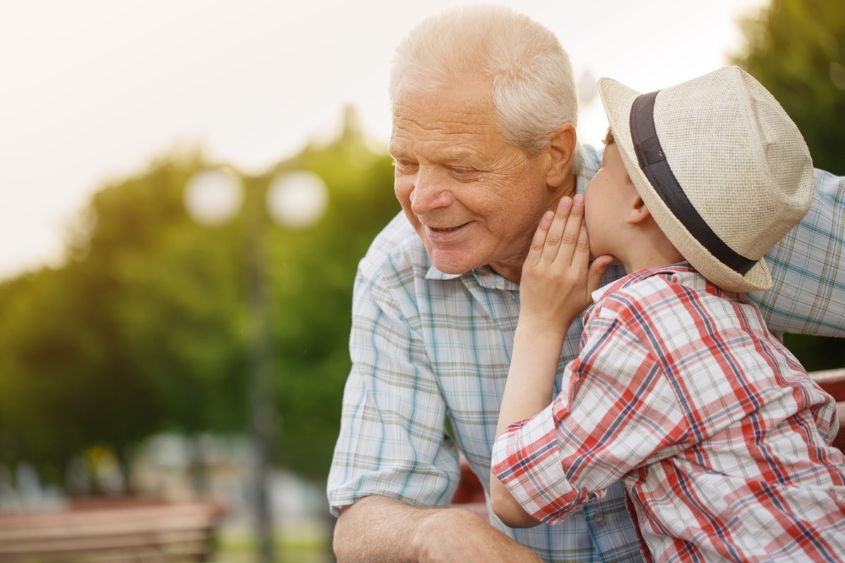 white boy whispering to grandpa