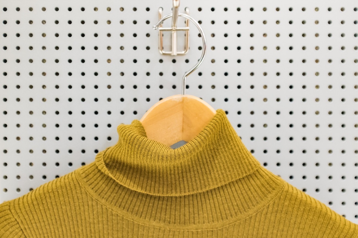 yellow turtleneck on hanger