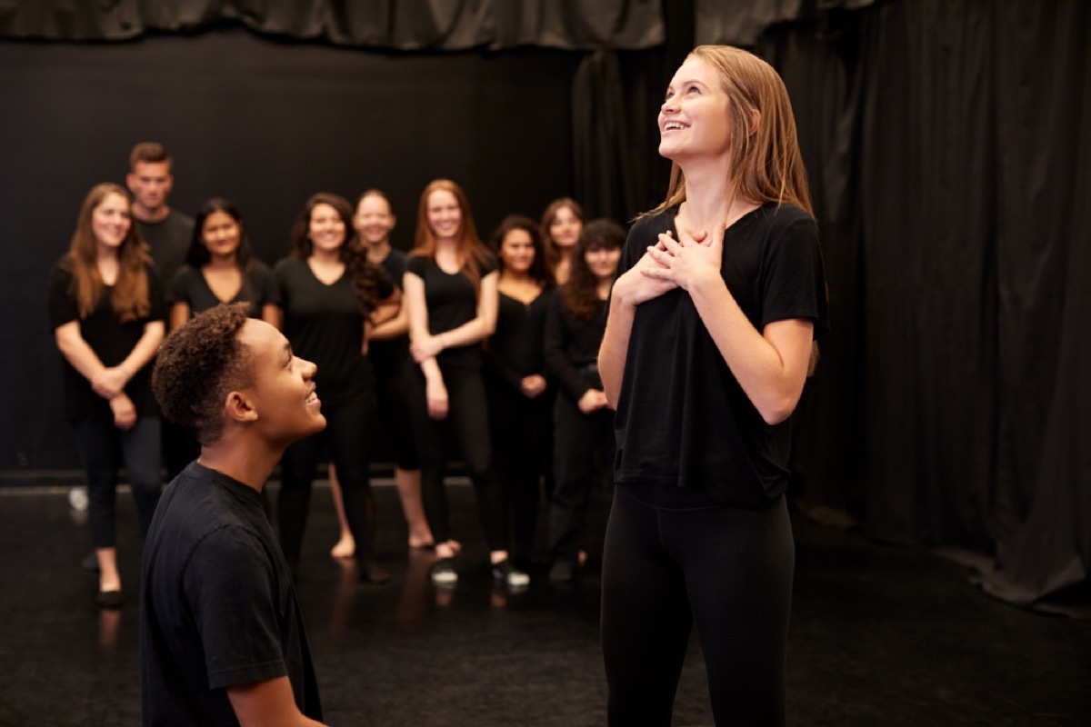 high school students rehearsing a scene during play rehearsing