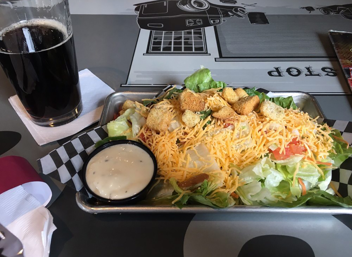 side salad with ranch dressing and soda