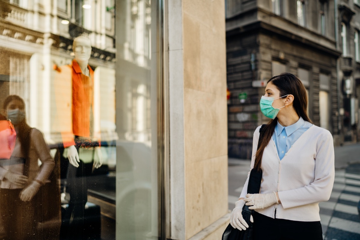 woman wearing mask shopping during the pandemic