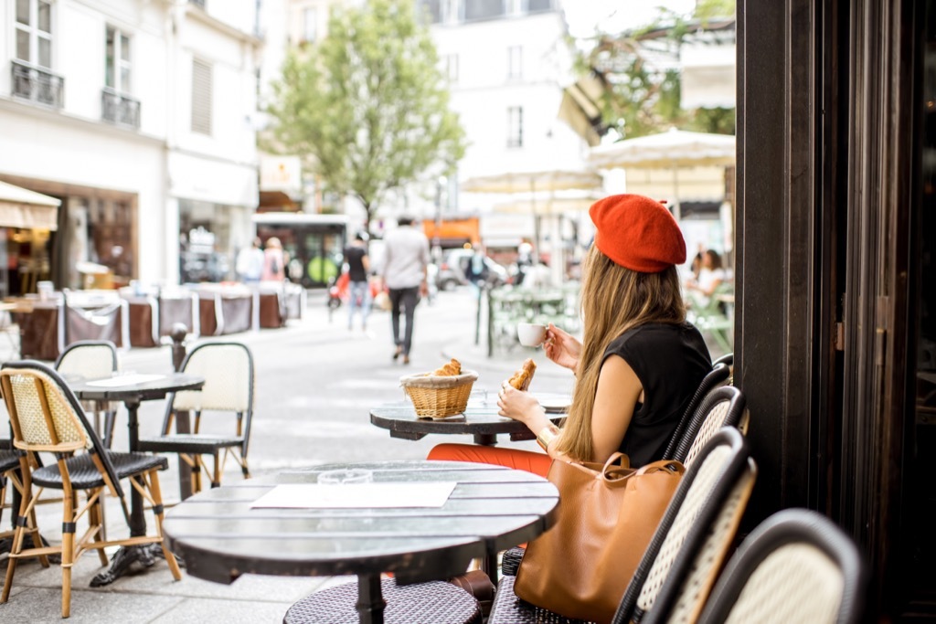 Woman Relaxing at Cafe Italians