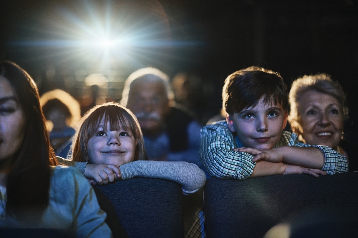 Grandparents taking their grandchildren to the theater