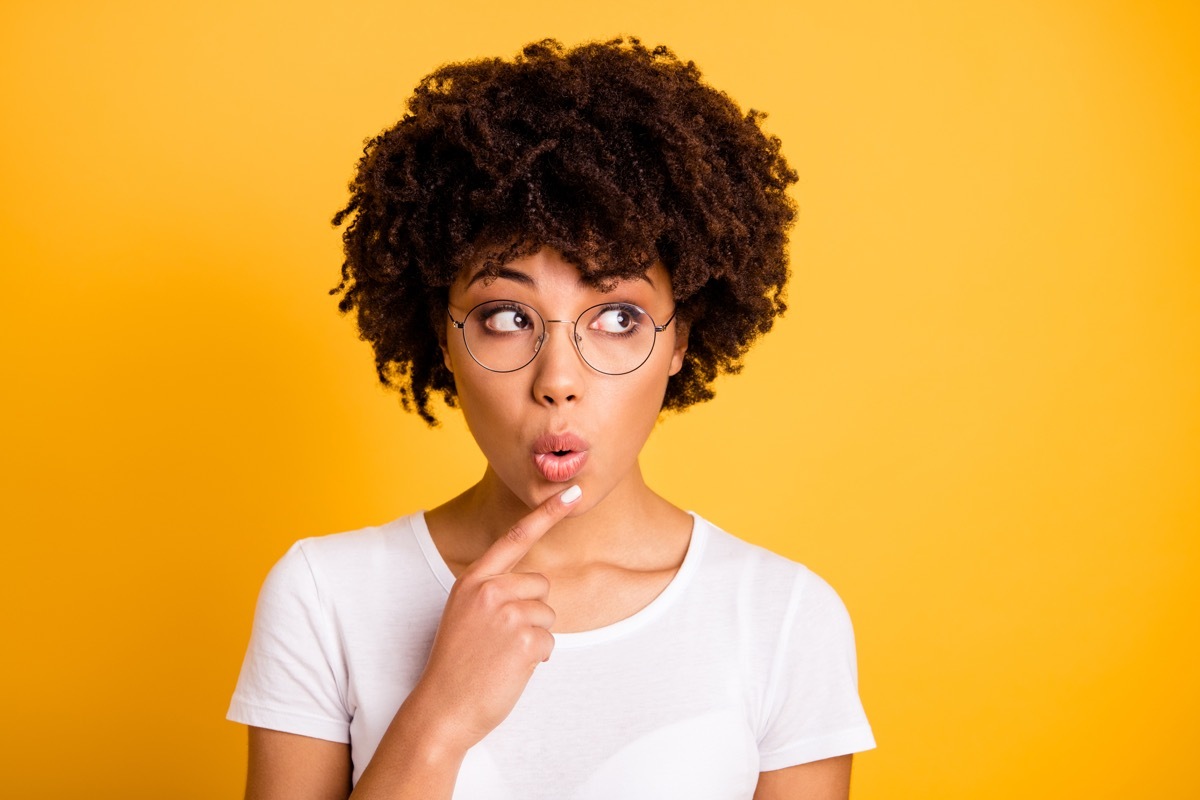 Close-up portrait of her she nice cute lovely charming attractive beautiful minded wavy-haired lady touching chin looking aside isolated over bright vivid shine background.