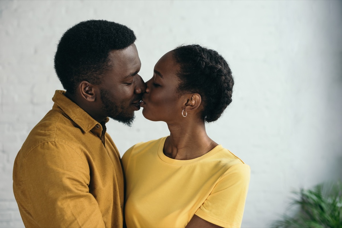 man and woman kissing