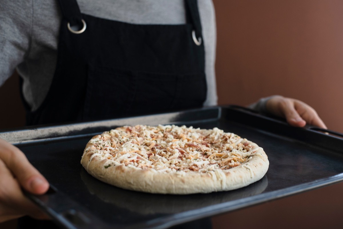 woman with frozen pizza