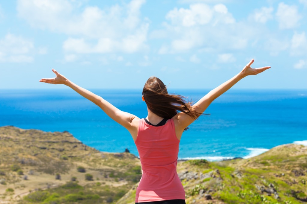 woman happy to be alive. At beach. Happiness is great for longevity. stressed out