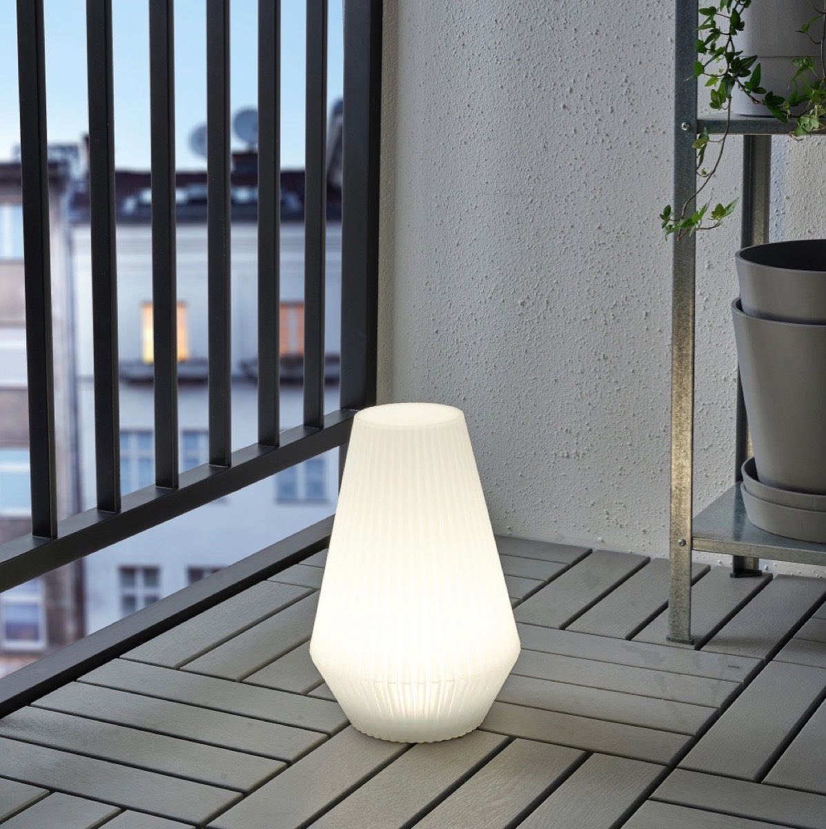 white ikea outdoor lamp on deck