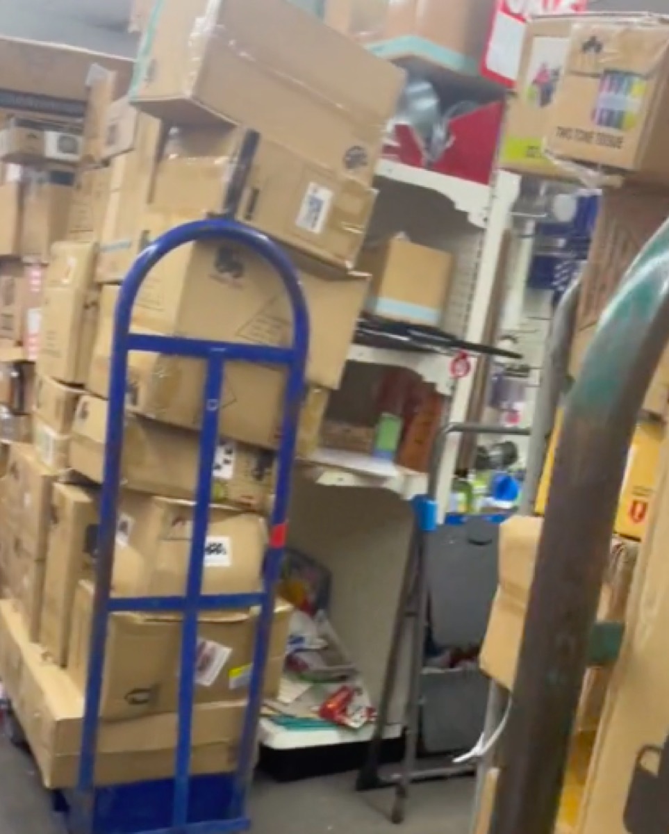 TikTok video still showing boxes blocking store shelves in Dollar Tree