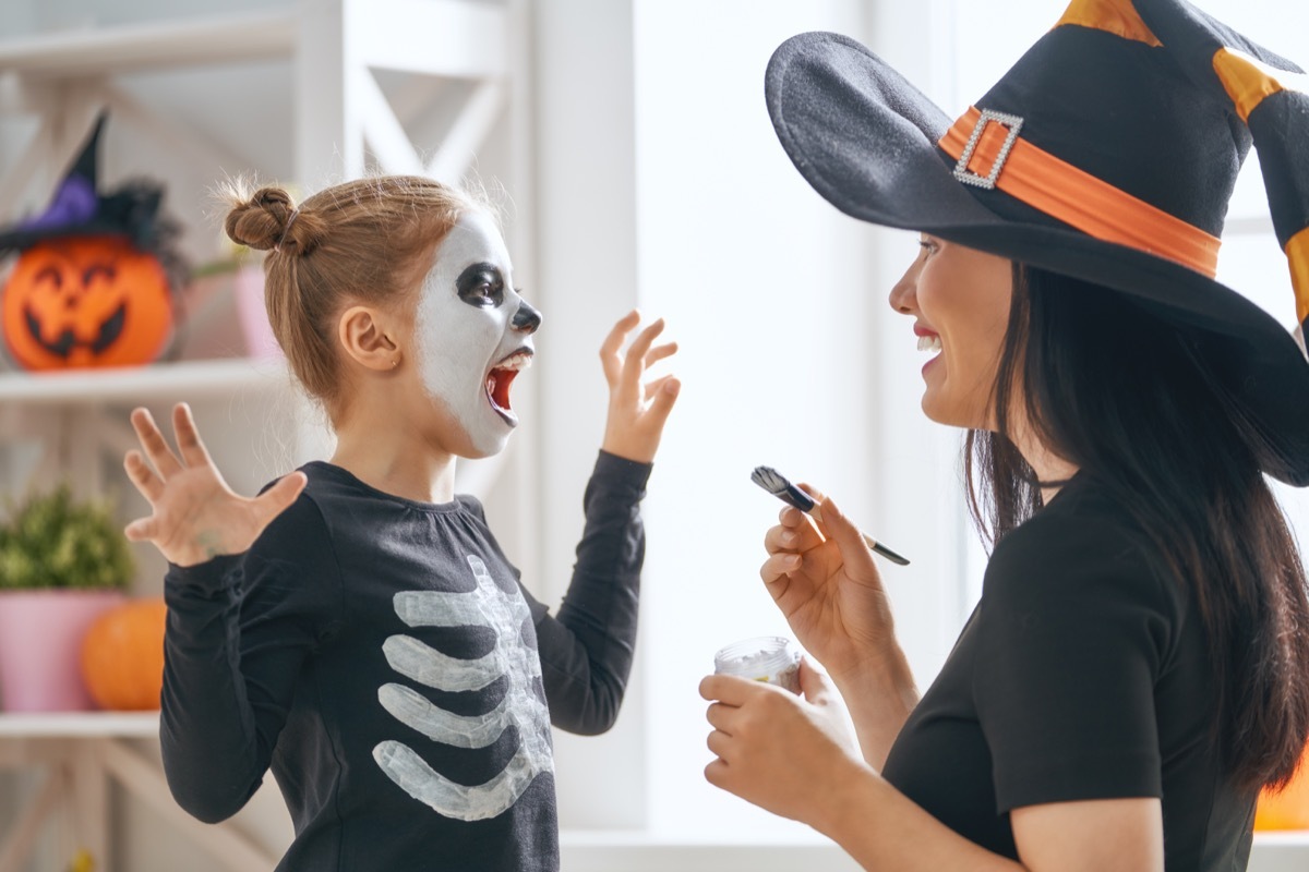 daughter laughing at halloween jokes and pun from a family