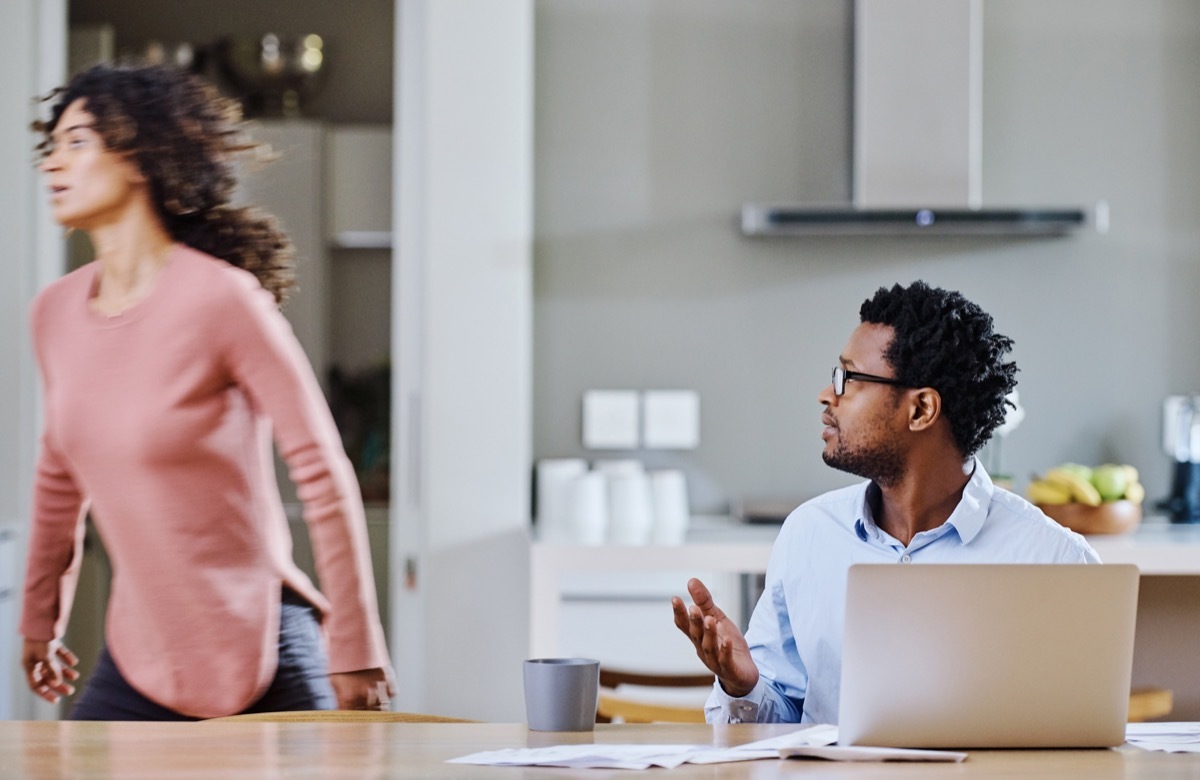 cropped shot of a young married couple having a disagreement in the kitchen at home with the woman not listening