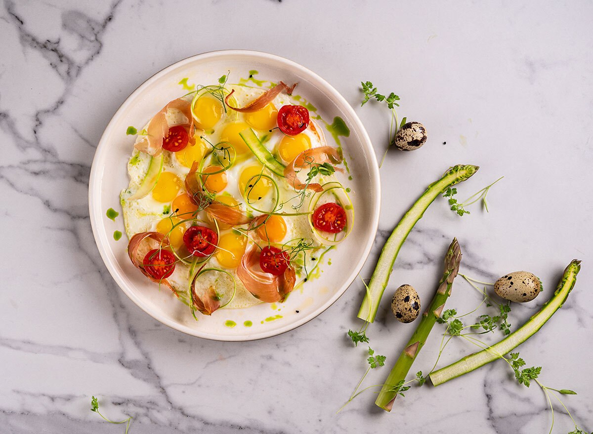 bacon eggs and vegetables scrambled in bowl