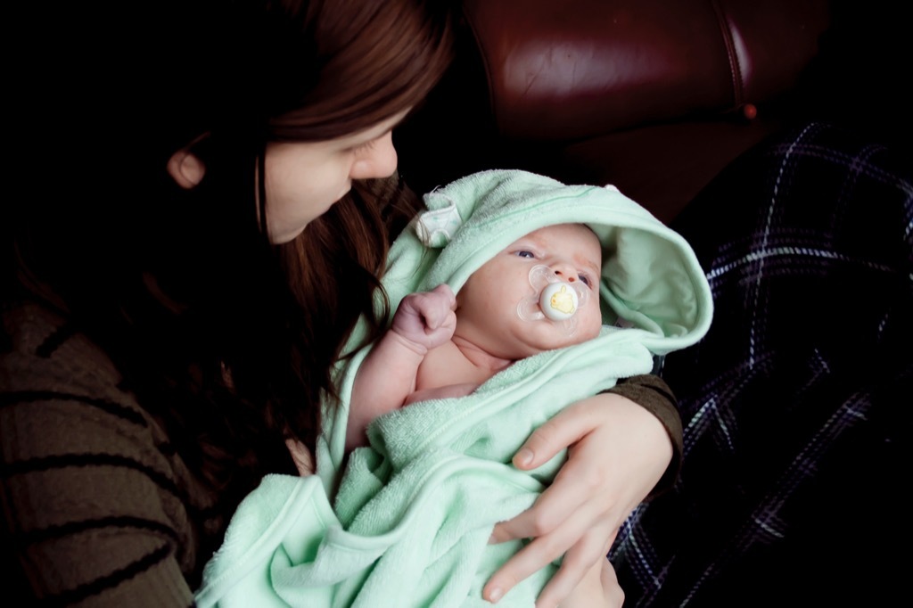 Woman holding a baby in a blanket