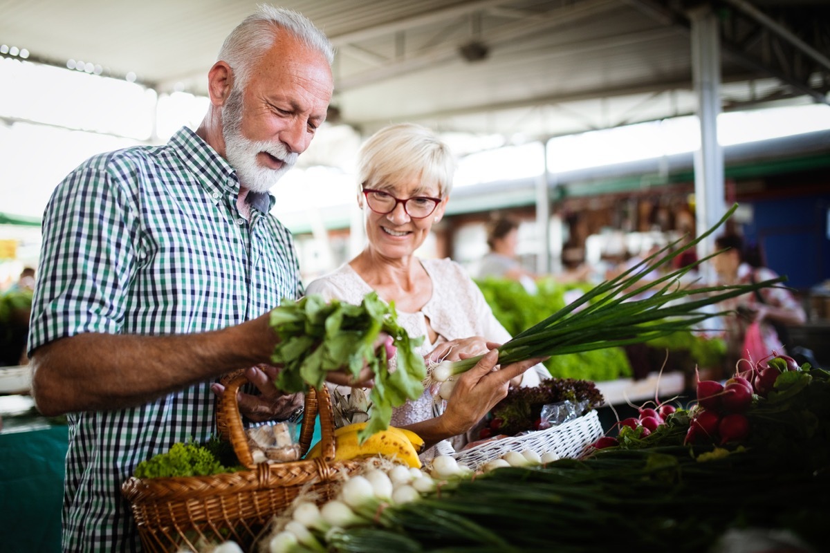 Senior couple shopping for produce at a farmer's market