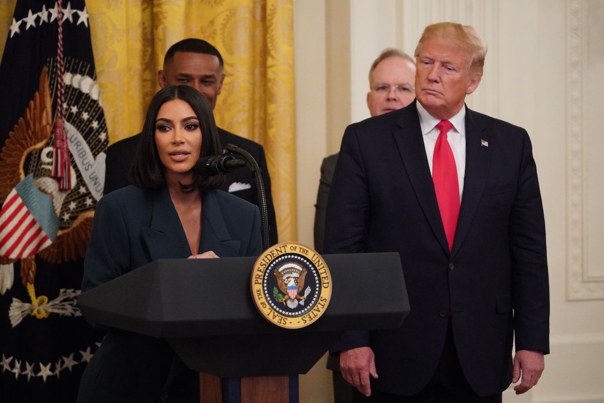 Kim Kardashian speaking at the White House alongside Donald Trump in 2019