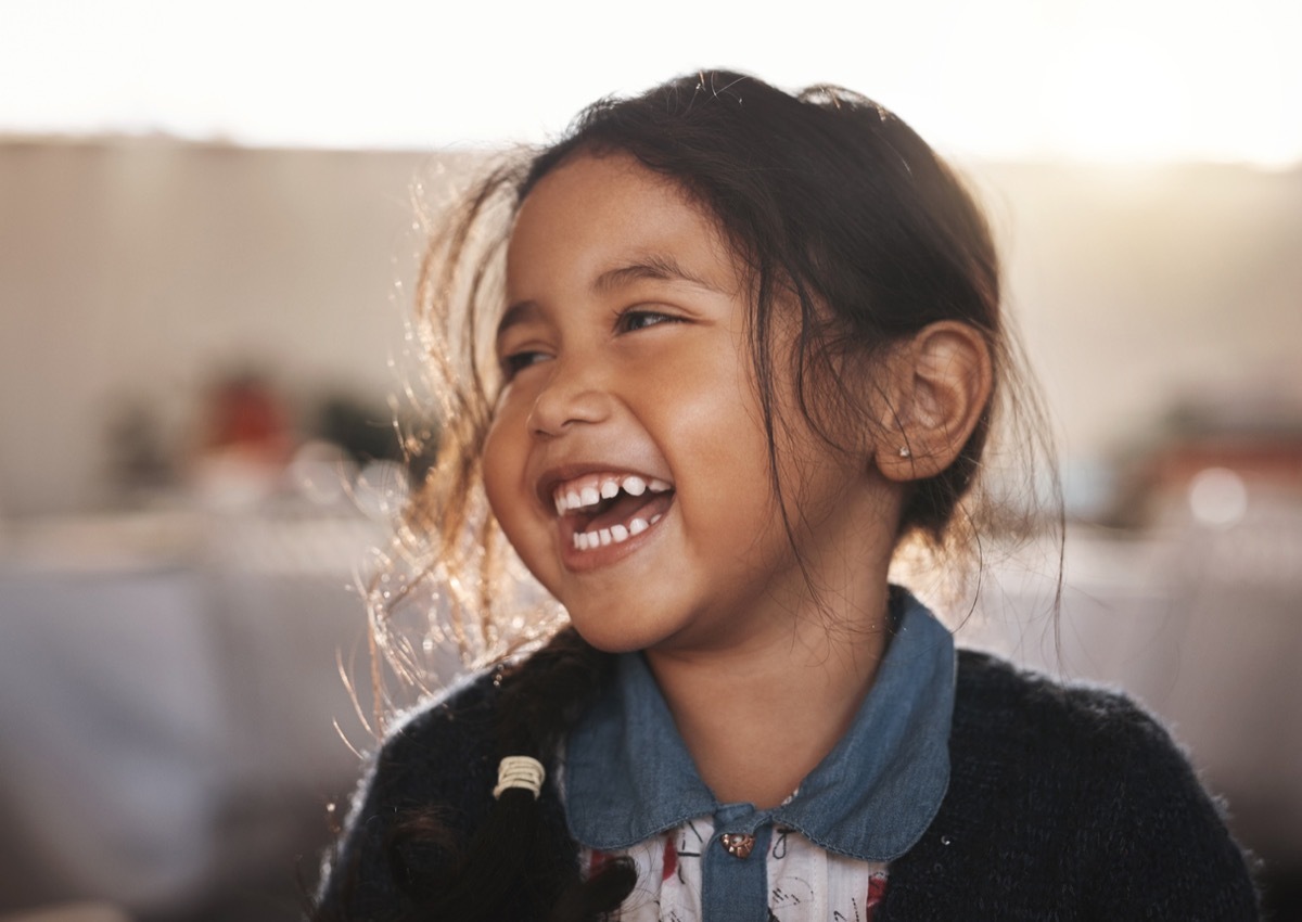 little girl laughing at funny knock knock jokes for kids