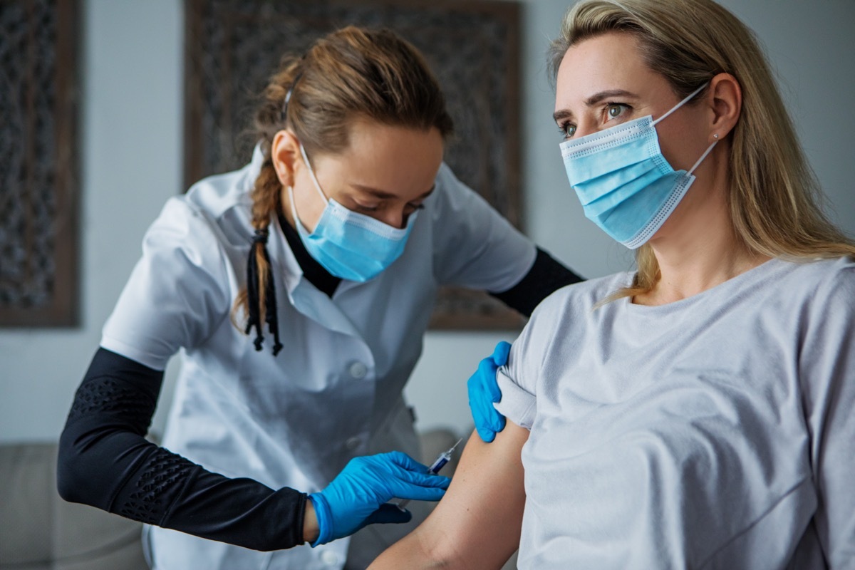 Home administered Covid-19 Vaccination by a female medical professional whilst respecting the lockdown due to the corona virus outbreak