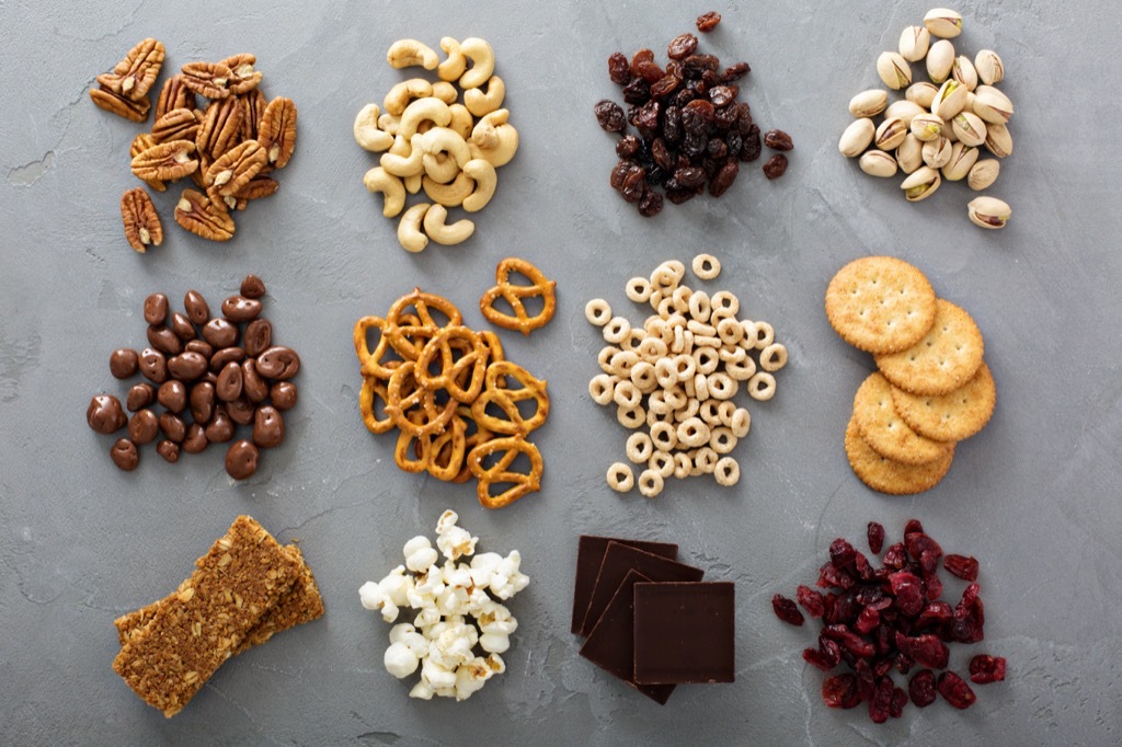 an assortment of nuts and pretzels and snacks