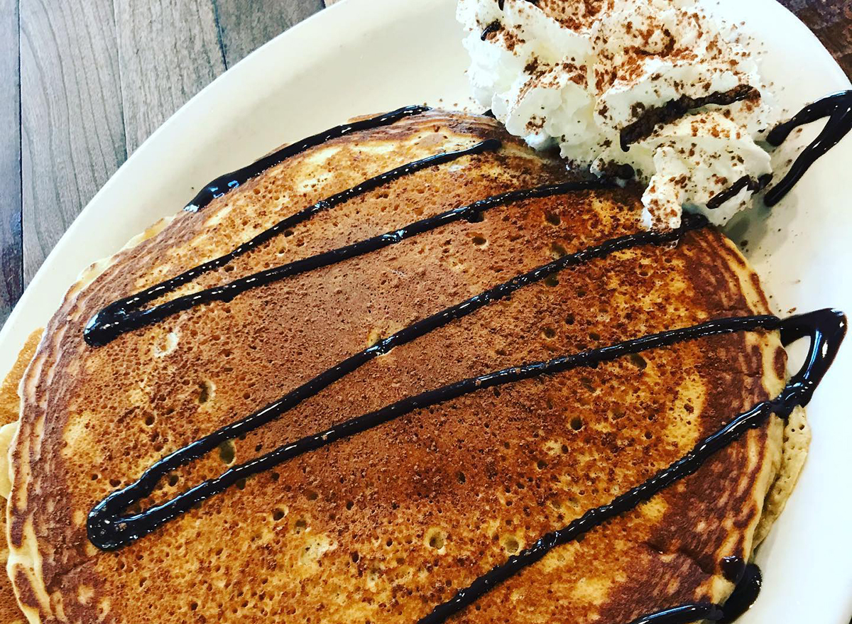 pancakes drizzled with chocolate syrup