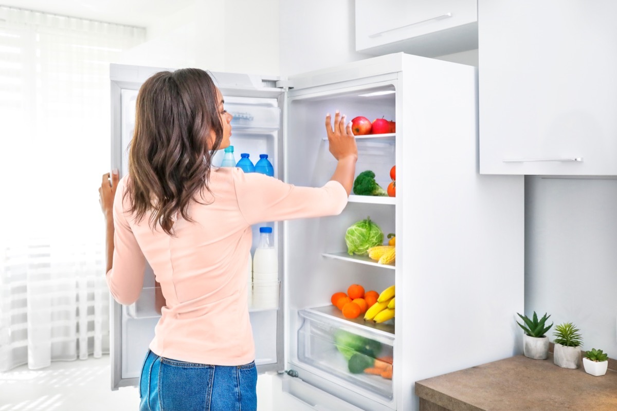 Woman Looking Through Fridge