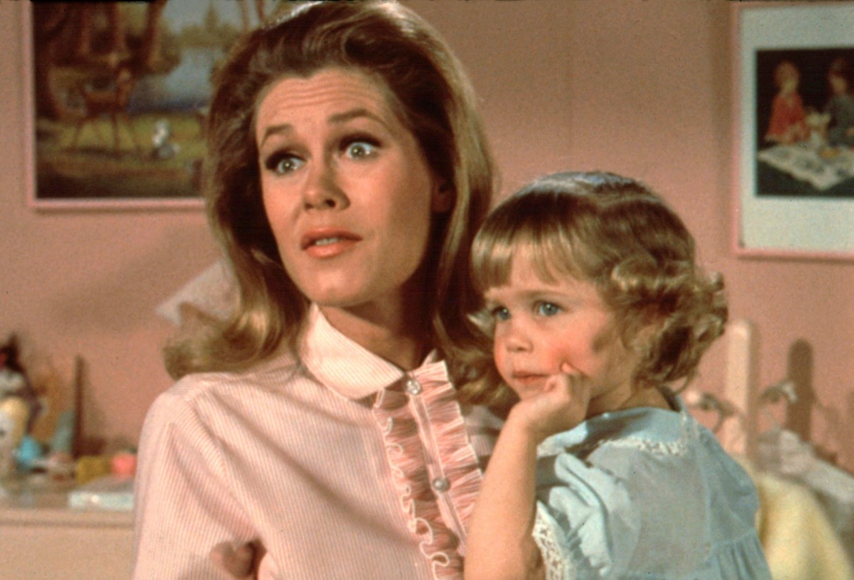 elizabeth montgomery holding small child from bewitched