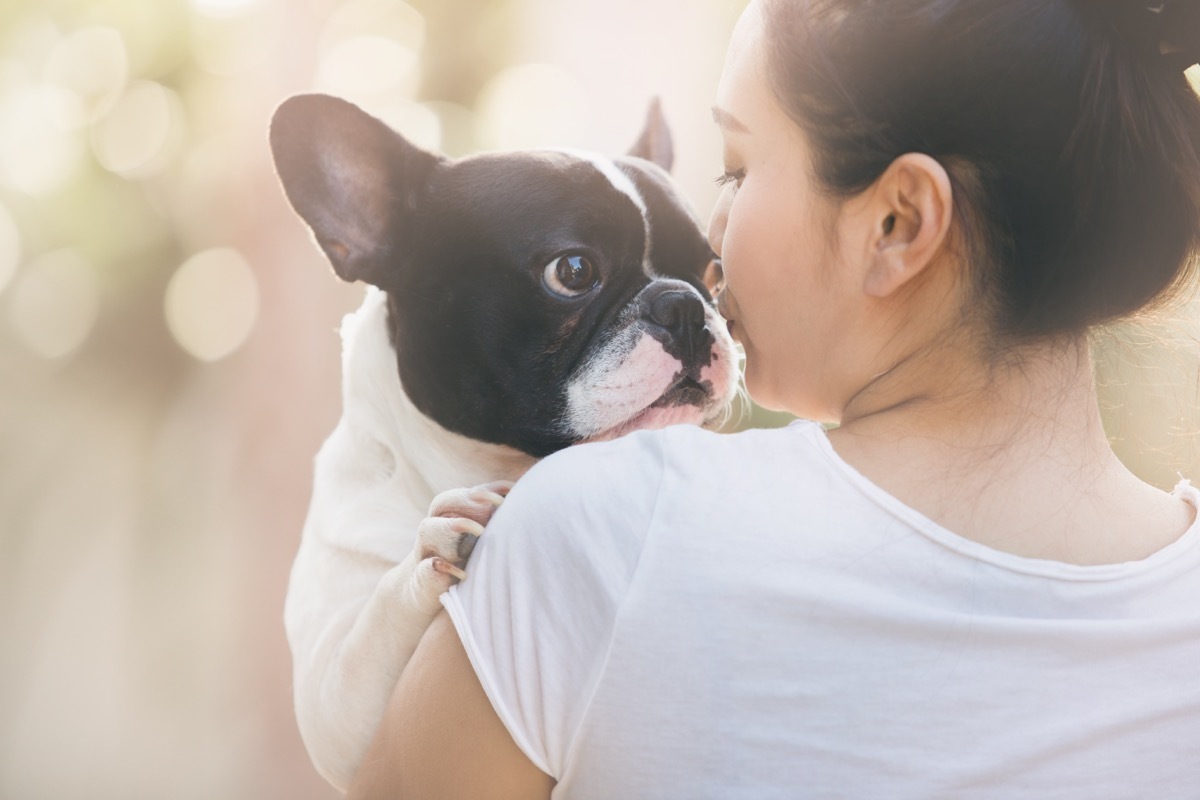 Woman holding little dog