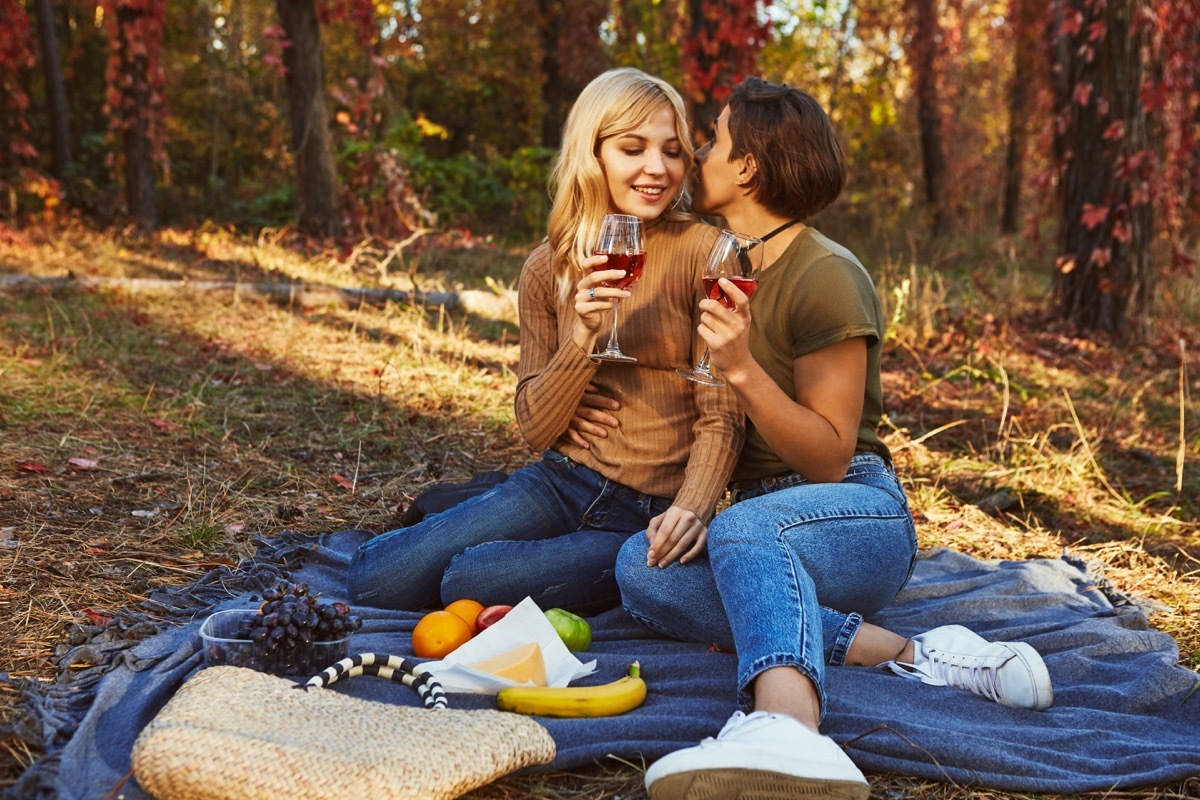 couple in love having a picnic, best anniversary date ideas