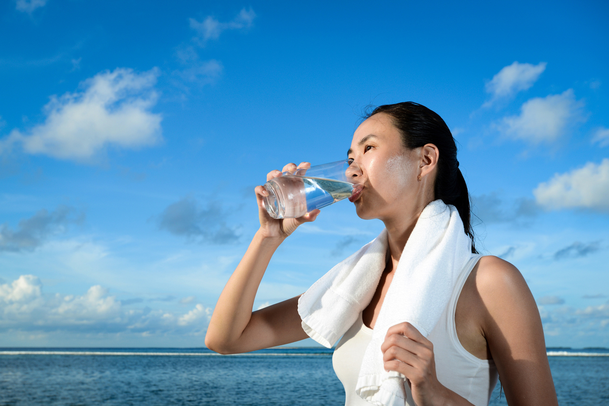 Woman drinking water.