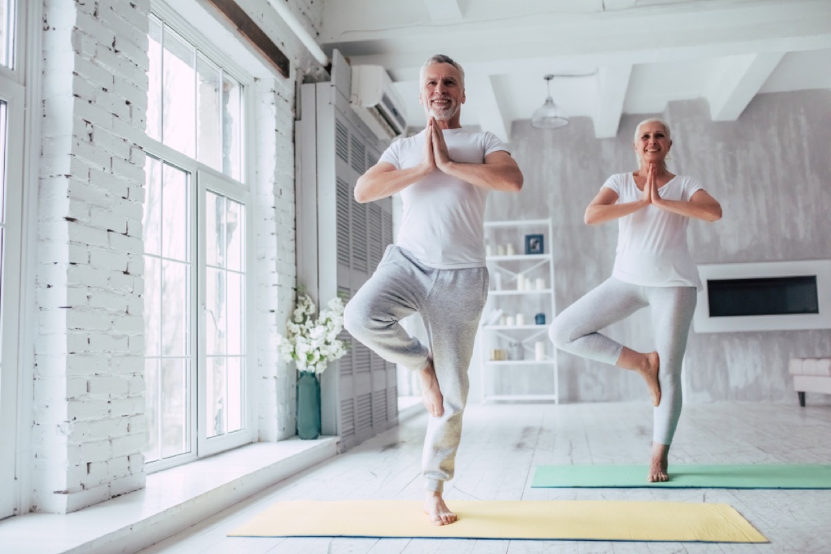 older couple in tree pose, better wife after 40