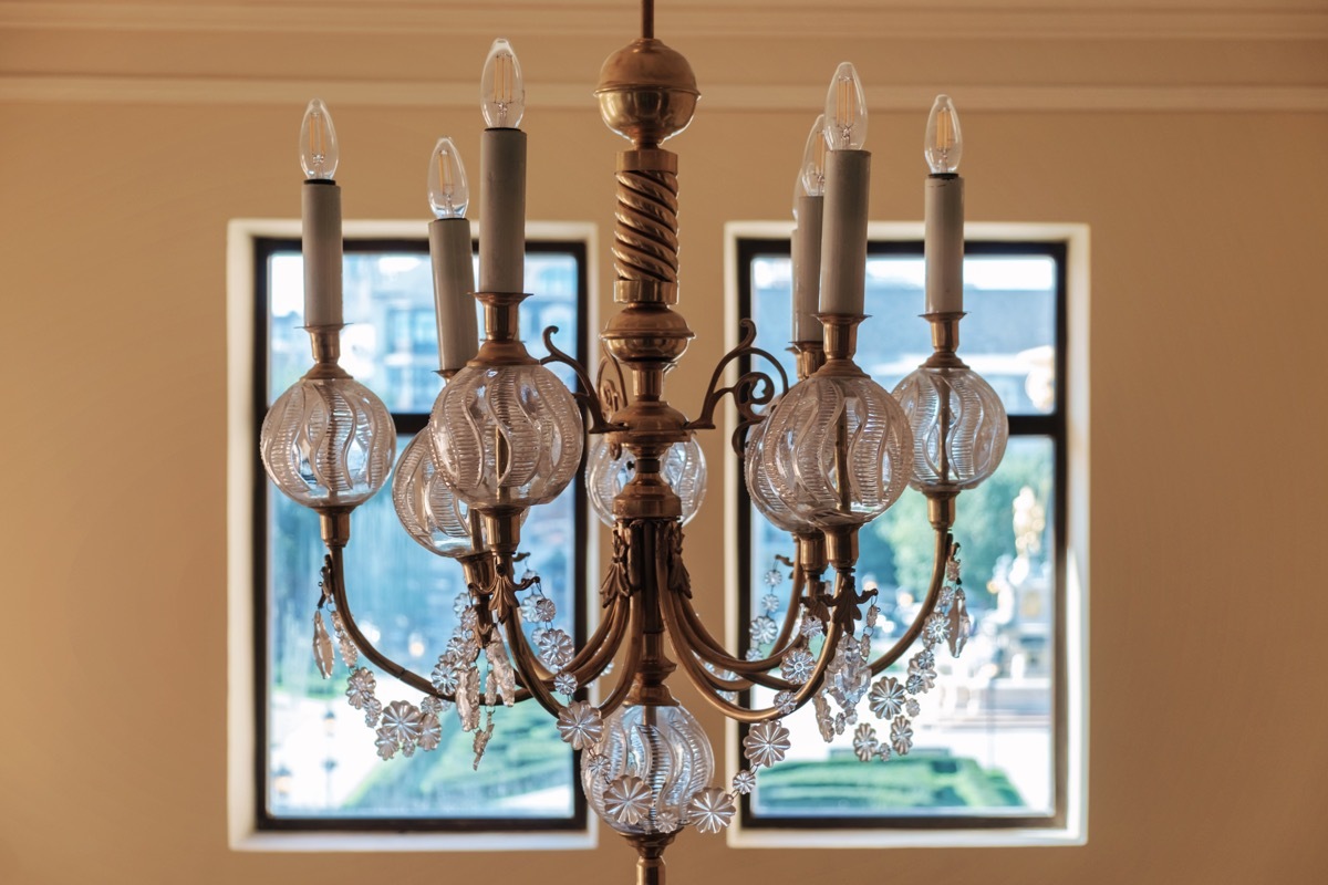 brass chandelier in front of window