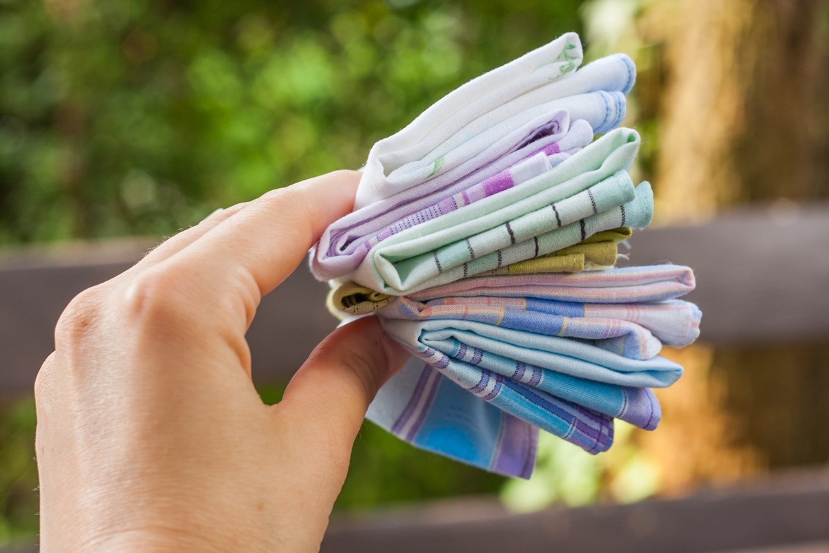 Using reusable textile, pure cotton colourful handkerchiefs for blowing nose instead of single use paper tissues