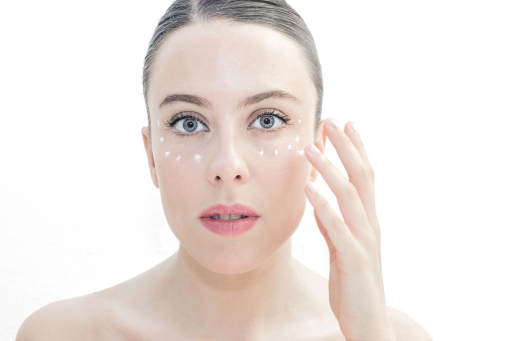 Woman Applying Eye Cream Anti-Aging