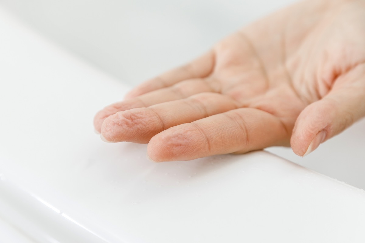 Female hand with wrinkles after bath