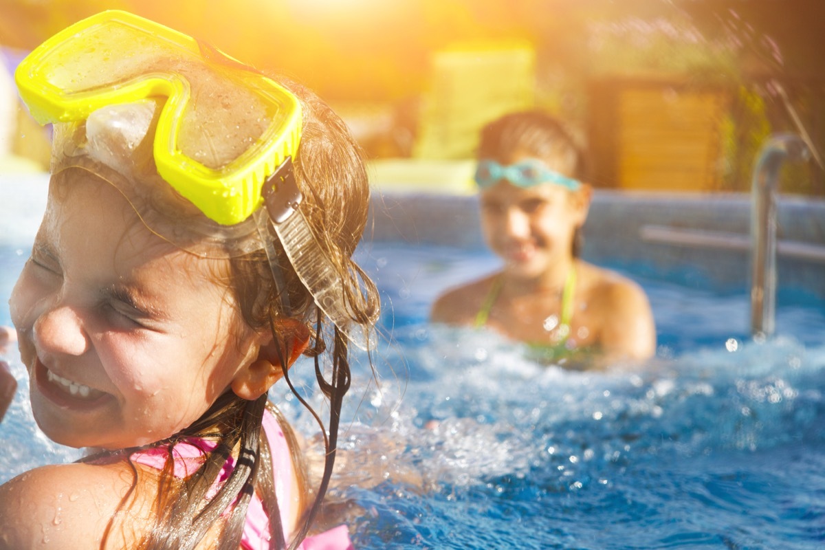 two little girls having fun in the pool