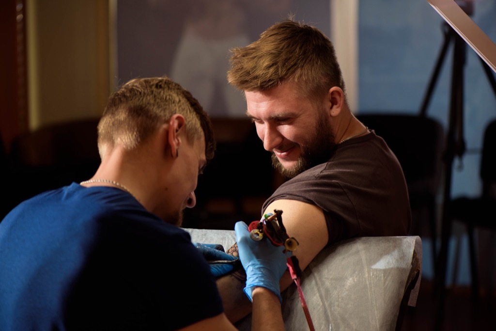 man getting tattoo