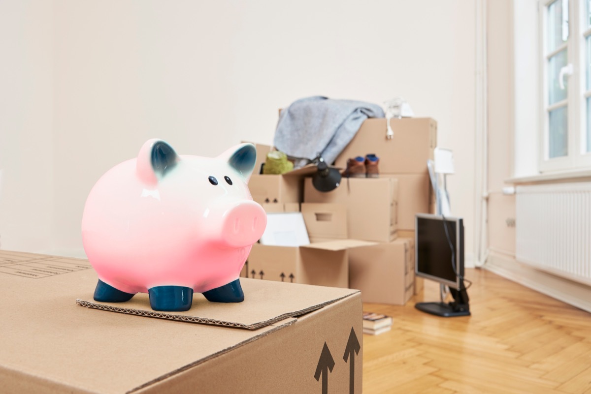 photograph of people moving boxes to downsize, 