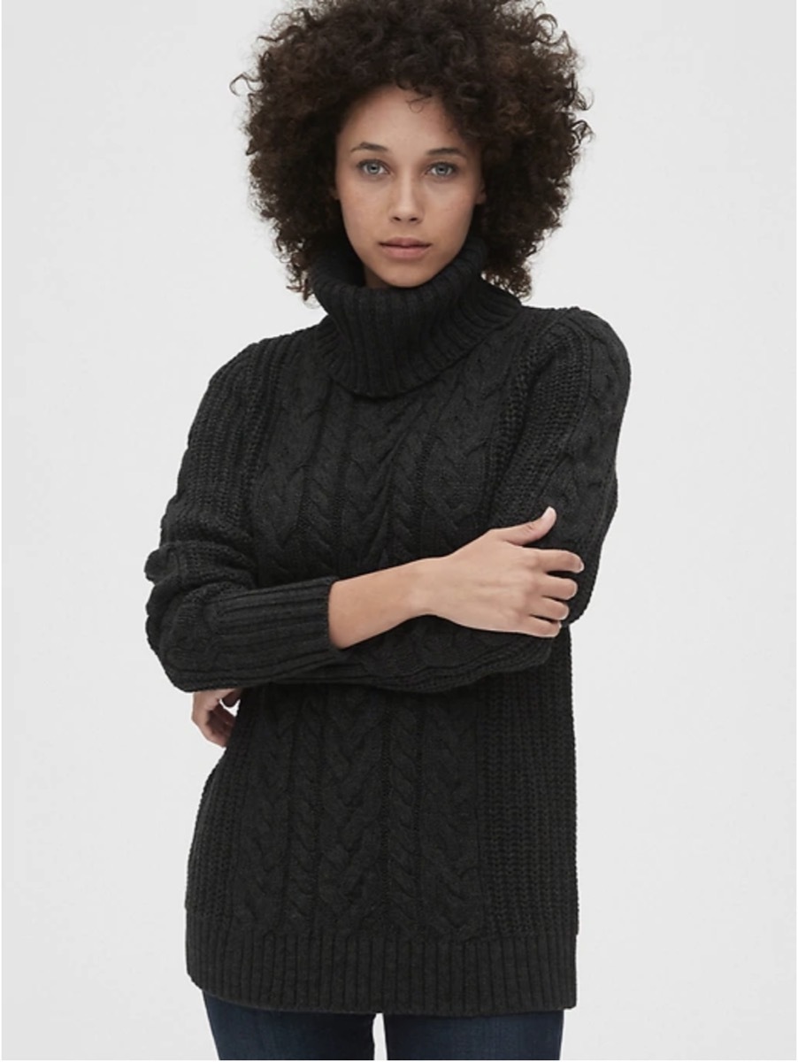 black woman wearing gray cable knit turtleneck