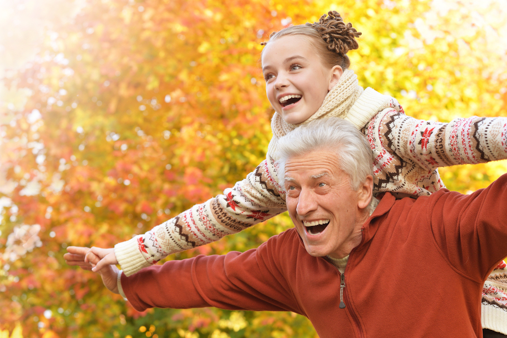 grandfather playing with granddaughter