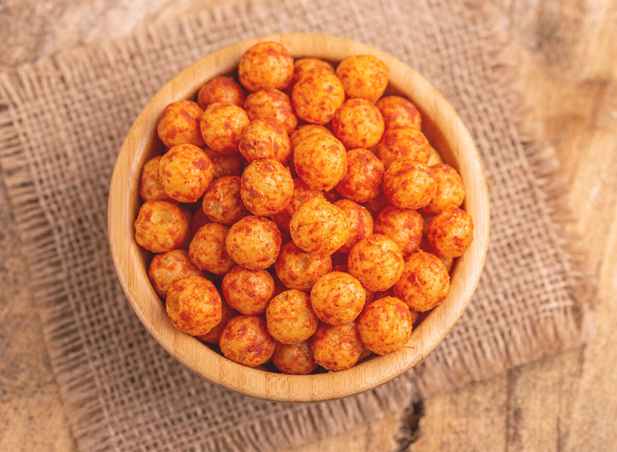 bowl of corn puffs balls with brown dust