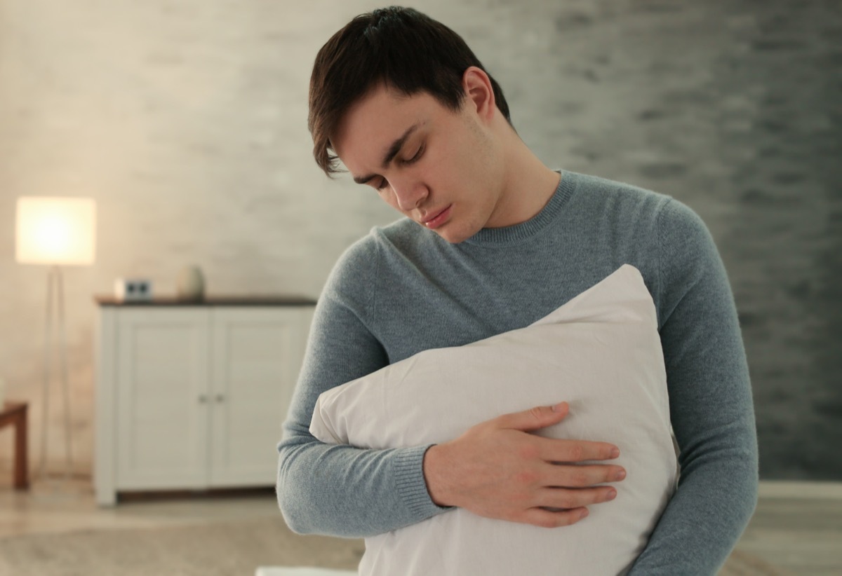 Man Sleepwalking Holding His Pillow