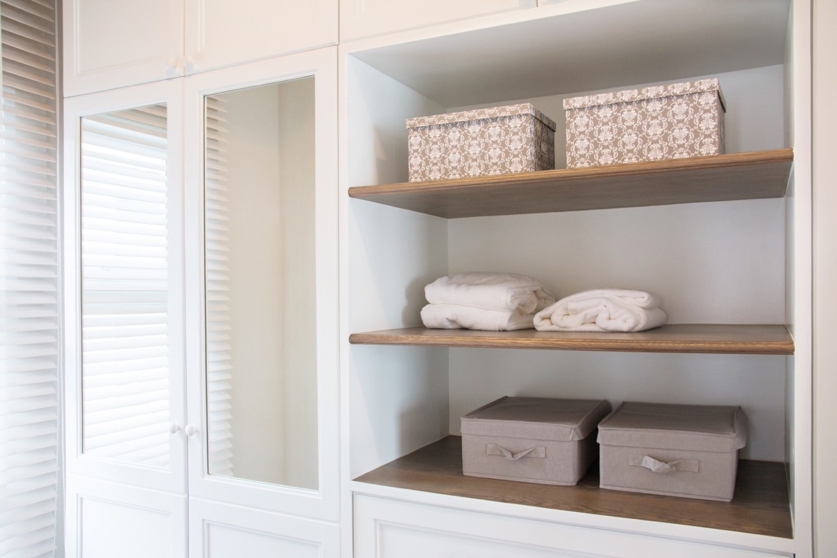 Detail of walk in closet with wardrobe.