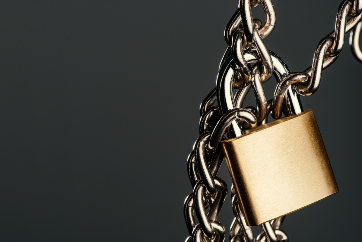 Gold padlock on silver chain