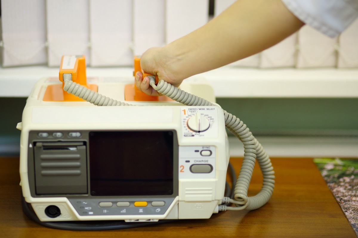 Hand resting on Electroshock Machine