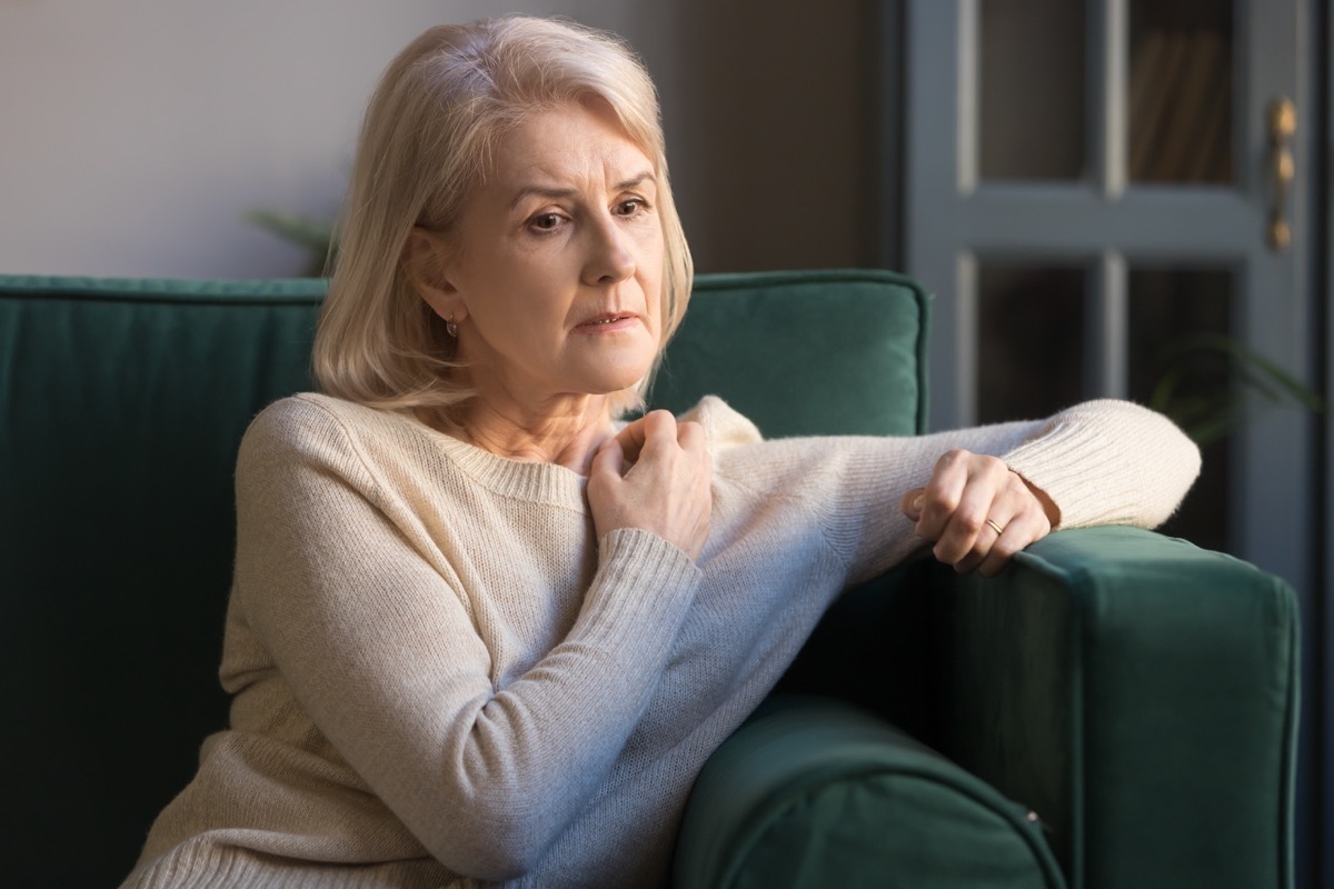 woman sitting on the couch and thinking