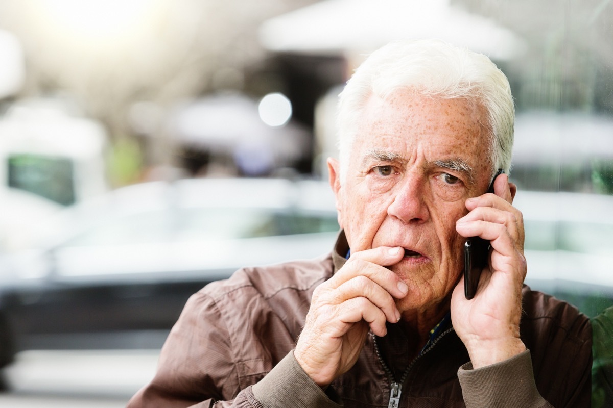 Man on phone looking worried