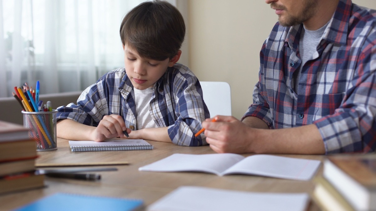 dad helping child with homework