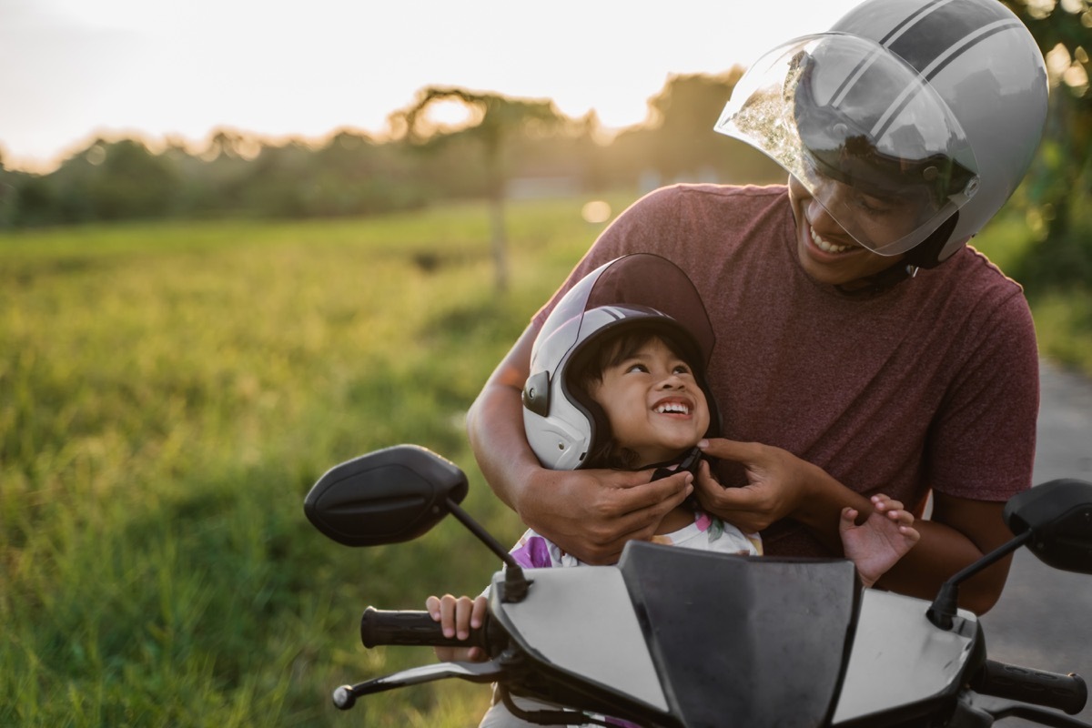 Father daughter on motorcycle